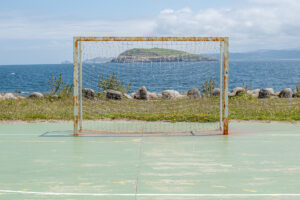 Abandoned goal in town island in background
